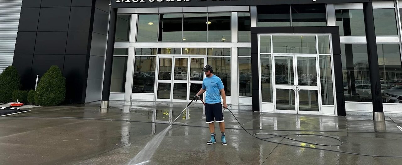 Pressure washing a car dealership
